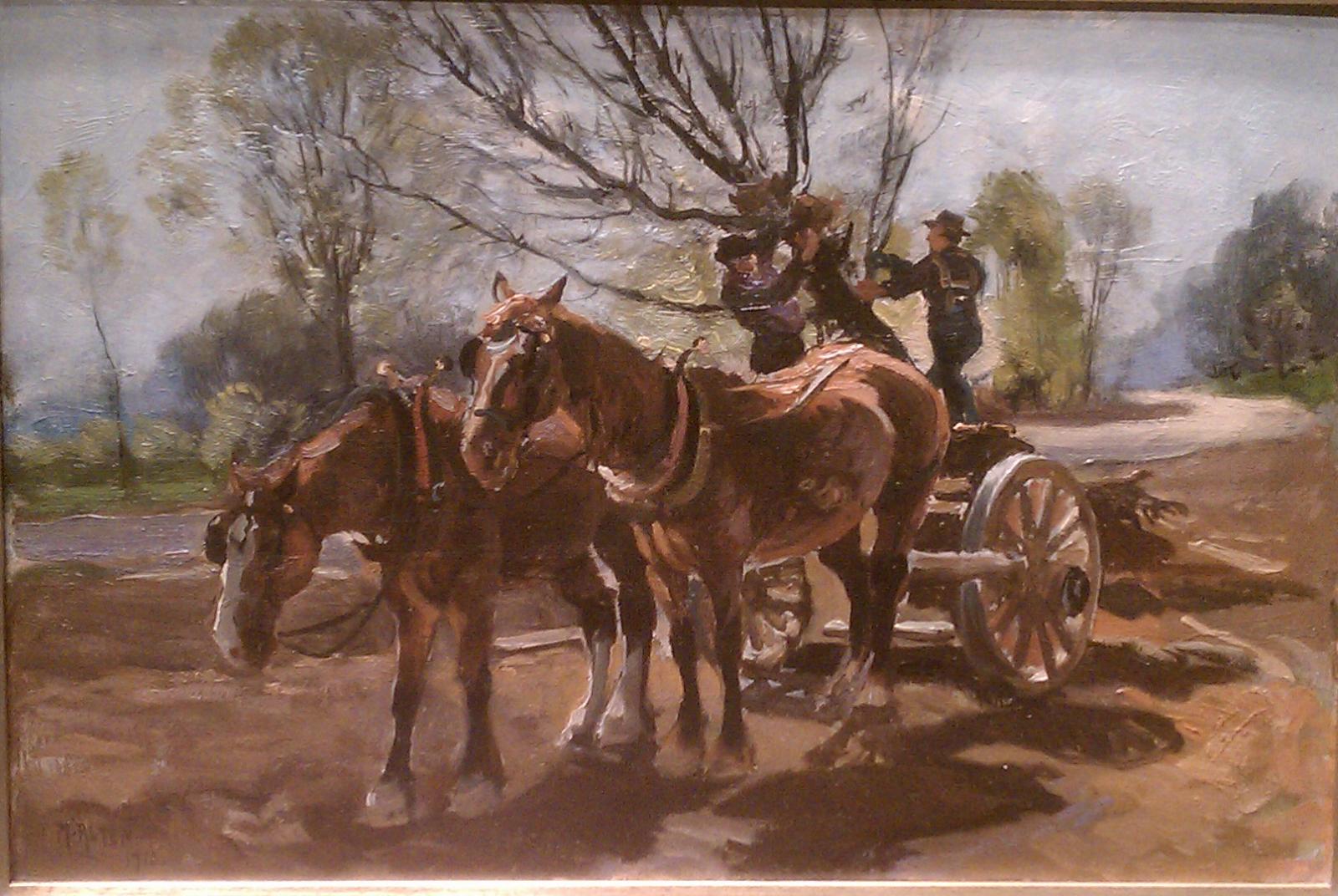 Two horses attached to a cart with two men pulling a tree into the cart.