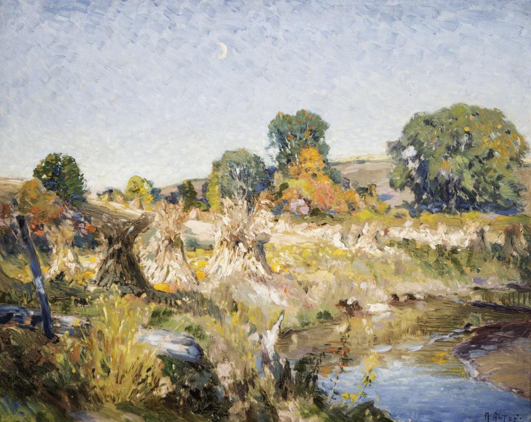 Landscape with a small stream bottom right, trees and corn shocks along the bank.
