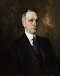 A portrait of an aging gentleman with gray hair and a mustache in a 20th century black suit, leaning to the right.