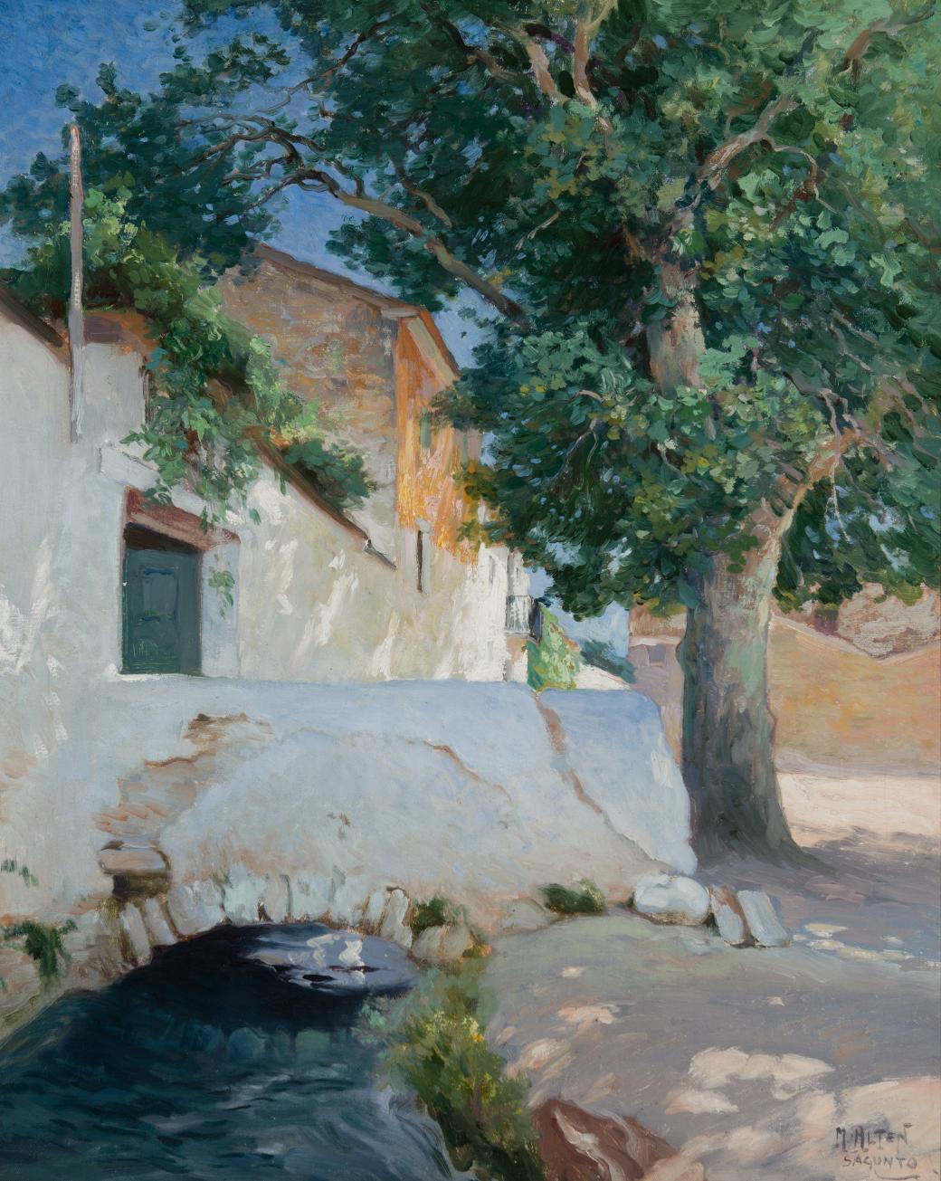 White house with a bridge over water.