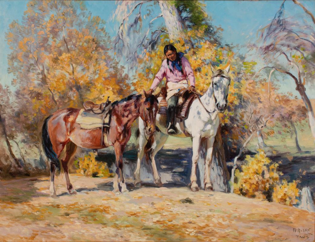 Person on a white horse, holding a the reigns of a brown horse.