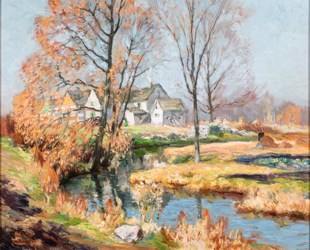 Creek in foreground, large white house in background.