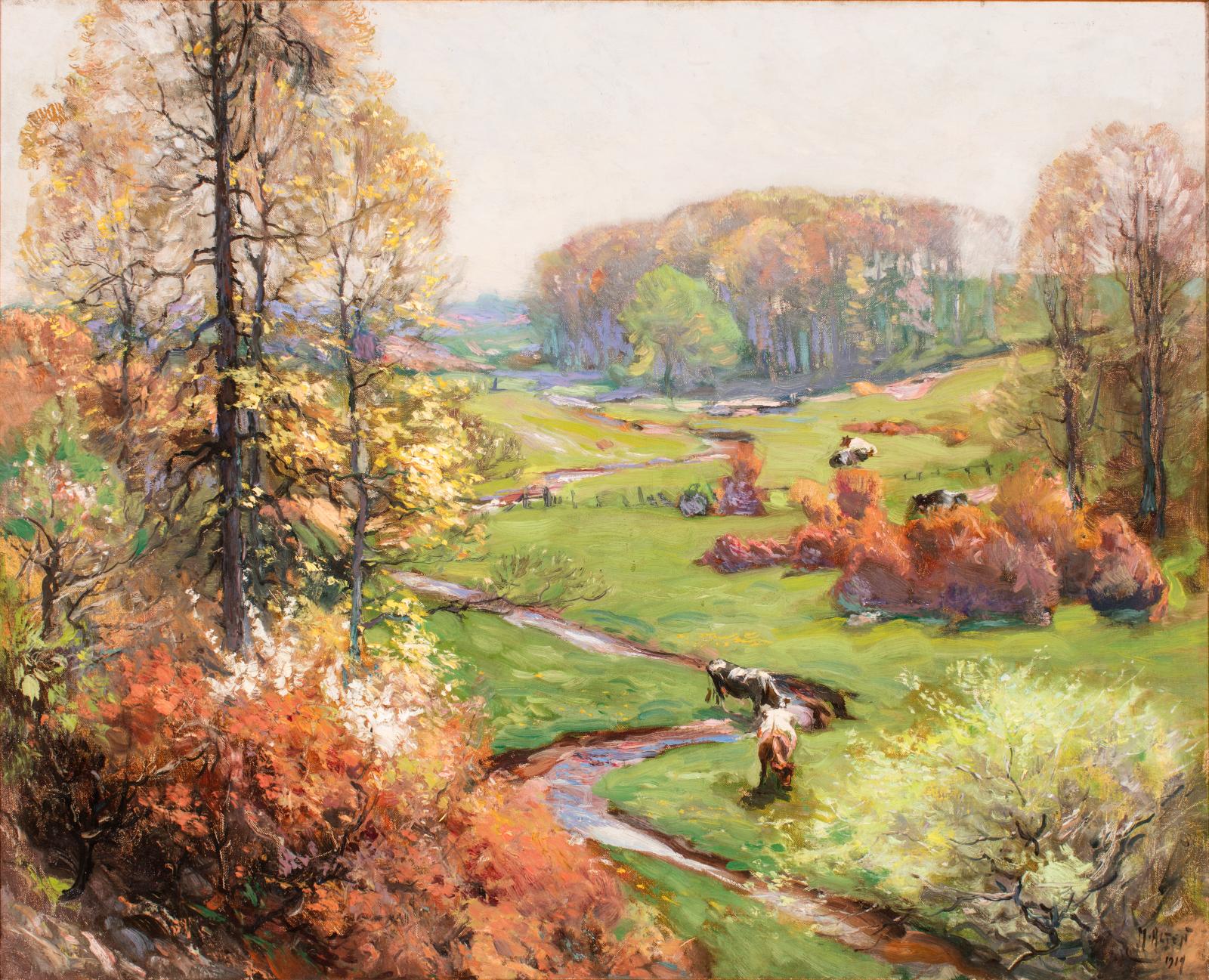 Two cows grazing in foreground of landscape image with green grass, pale sky, yellow leaves, and a meandering stream.