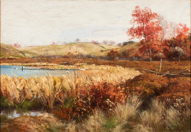 Brown/tan landscape with a small body of water near the center, pale sky.