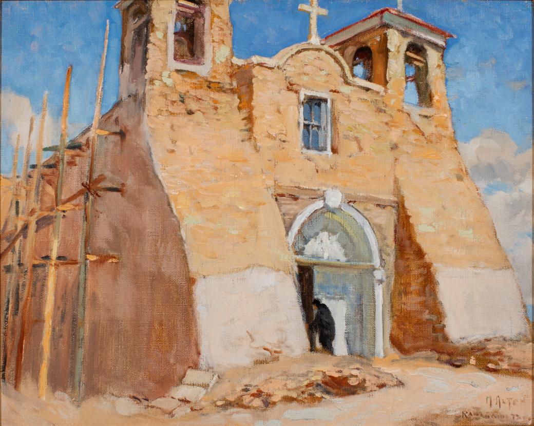 Tan building with a white door.