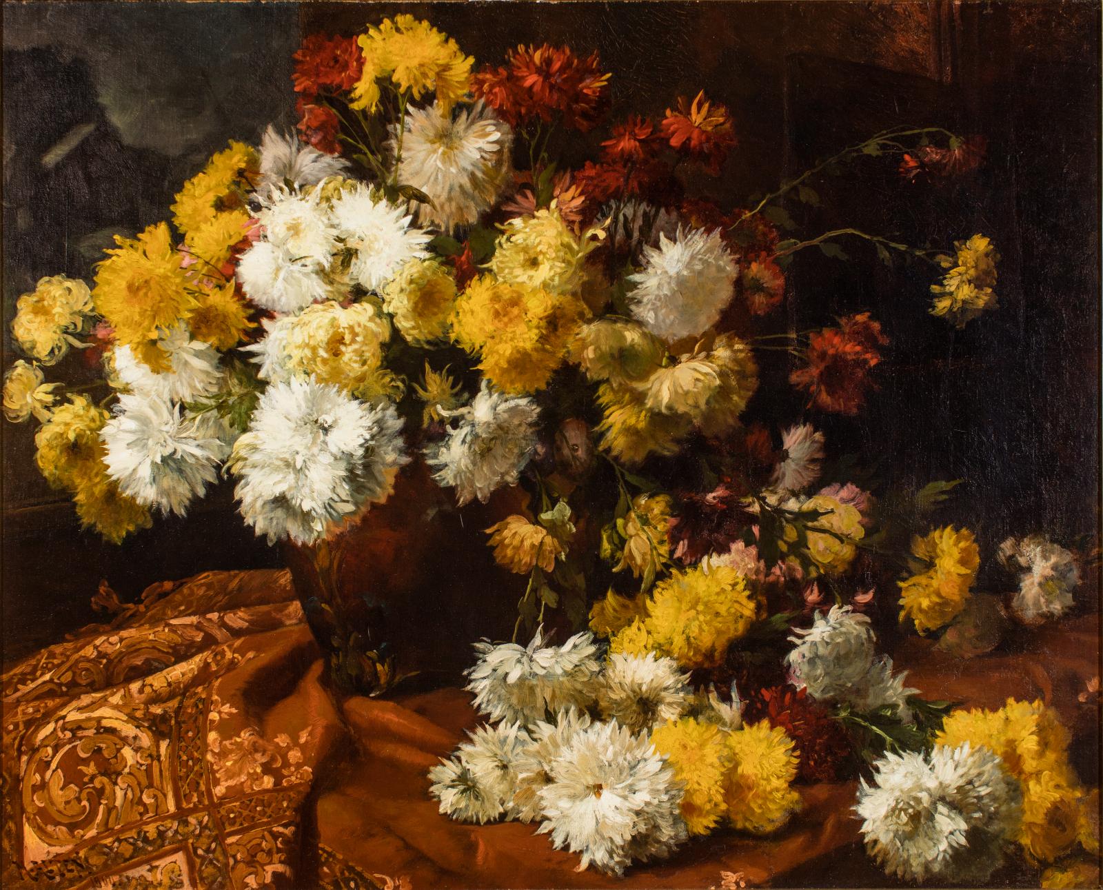 Still life of yellow and white chrysanthemum flowers against a dark background and a fabric covered table.