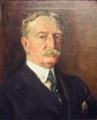 A portrait of an aging gentleman with blond hair and a blond mustache staring straight forward; body leans towards the right.