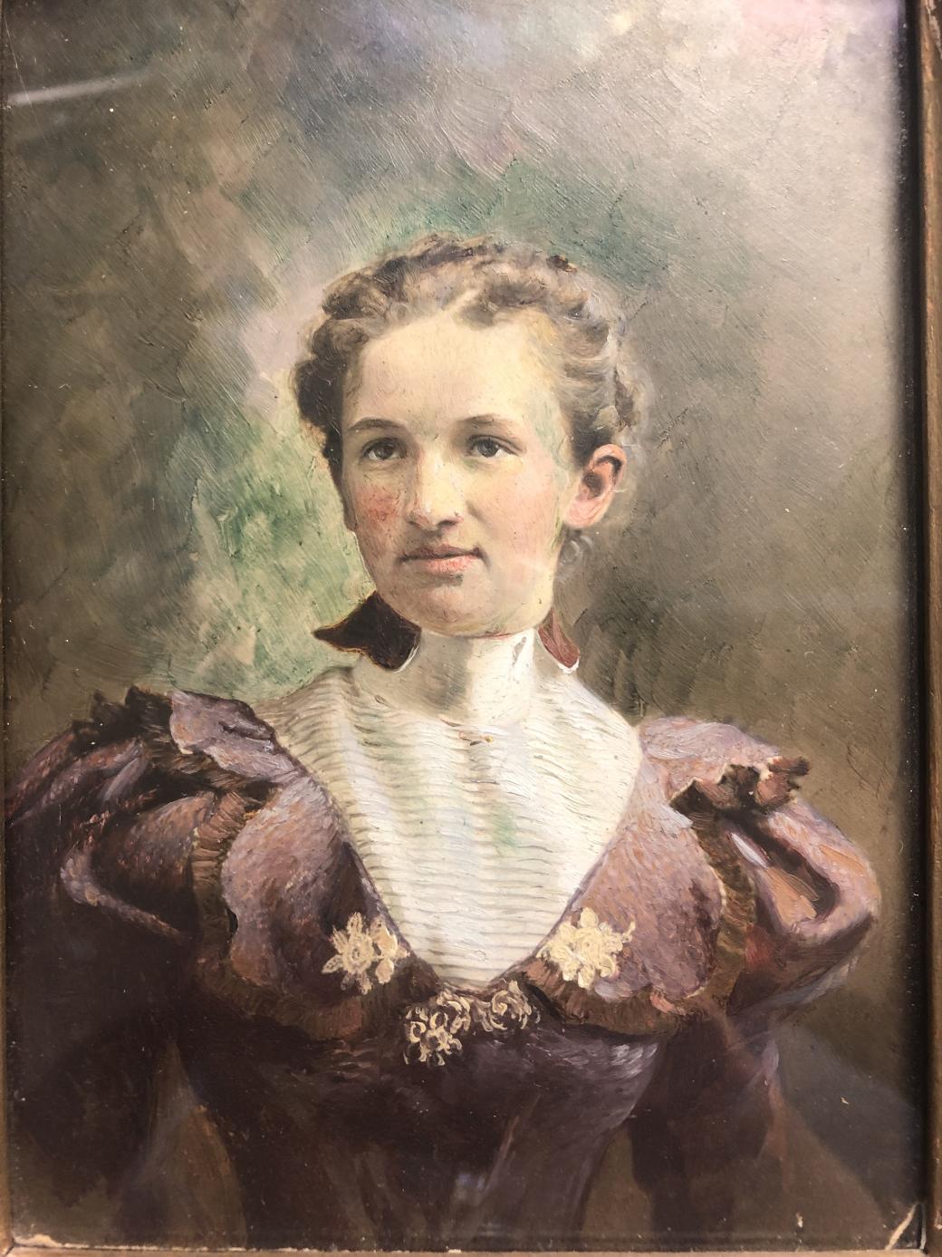 Portrait of a woman with her hair in braids.