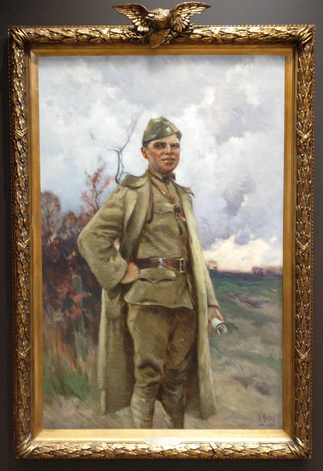 Oil on canvas painting of a man in uniform, one hand up at his waist, the other holding a rolled piece of paper.