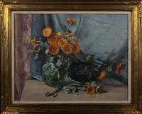 Oil painting on canvas of several orange calendulas in a glass pitcher. In front of the pitcher, there is a pair of…