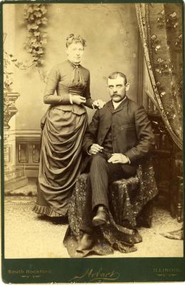 Untitled (Husband and Wife with Fabric Covered Chair)