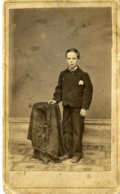 Untitled (Boy Standing with Table)