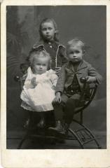 Untitled (Three Children with Chair)