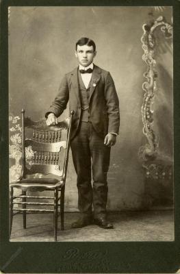 Untitled (Young Man with Chair)