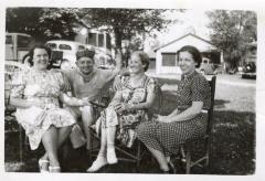 Untitled (Three Women In Chairs With A Crouching Man)