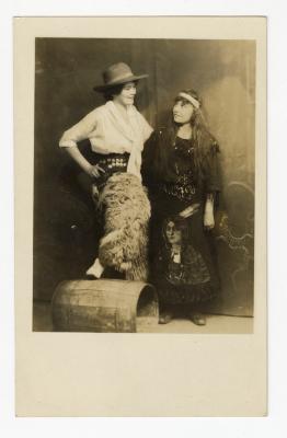 Untitled (Two women in costumes with barrel)