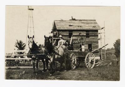 Untitled (Man and Two Children in Horse Drawn Carriage) 