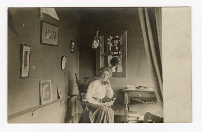 Untitled (Woman sitting in rocking chair in front of mirror)