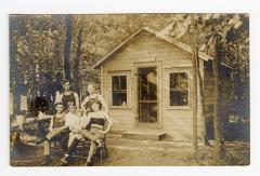 Untitled (Men in Front of a Cabin)