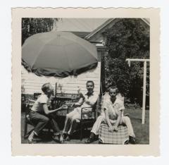 Untitled (Three Boys Under Umbrella) 